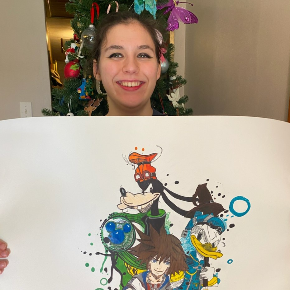 Hannah Durel proudly holds her illustration featuring Donald Duck, Goofy, and an anime character.